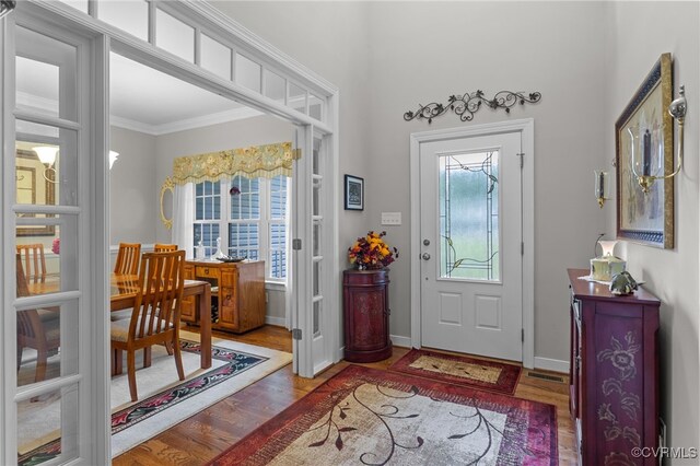 1638 Olde Links Dr, Powhatan, VA 23139 - foyer entrance featuring plenty of natural light, wood finished floors, and ornamental molding
