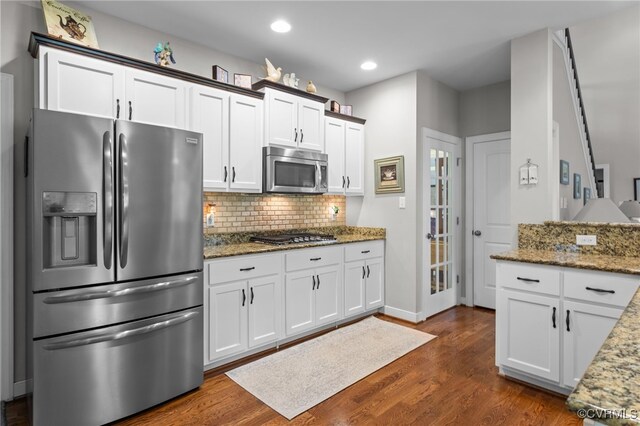 1638 Olde Links Dr, Powhatan, VA 23139 - kitchen featuring appliances with stainless steel finishes, light stone counters, dark wood finished floors, tasteful backsplash, and recessed lighting