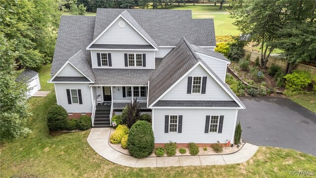 1638 Olde Links Dr, Powhatan, VA 23139 - traditional home featuring roof with shingles, a porch, stairway, and crawl space