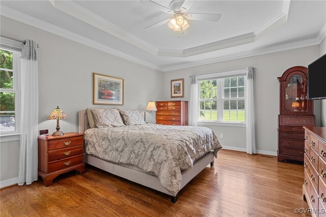 1638 Olde Links Dr, Powhatan, VA 23139 - bedroom featuring a raised ceiling, wood finished floors, ornamental molding, and a ceiling fan