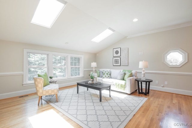 10801 Cherry Hill Dr, Glen Allen, VA 23059 - living area with a skylight, plenty of natural light, light wood finished floors, vaulted ceiling, and ornamental molding