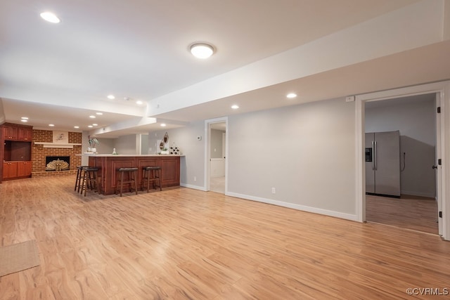 10801 Cherry Hill Dr, Glen Allen, VA 23059 - unfurnished living room with bar area, light wood-style floors, recessed lighting, and a fireplace