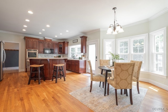 10801 Cherry Hill Dr, Glen Allen, VA 23059 - dining area with ornamental molding, a chandelier, light wood finished floors, and recessed lighting