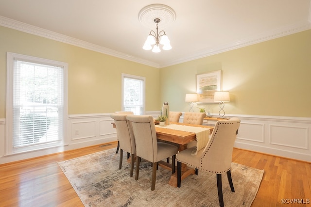 10801 Cherry Hill Dr, Glen Allen, VA 23059 - dining area with a chandelier, ornamental molding, a wainscoted wall, a decorative wall, and light wood finished floors
