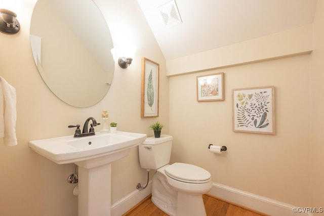 10801 Cherry Hill Dr, Glen Allen, VA 23059 - half bath featuring wood finished floors and vaulted ceiling