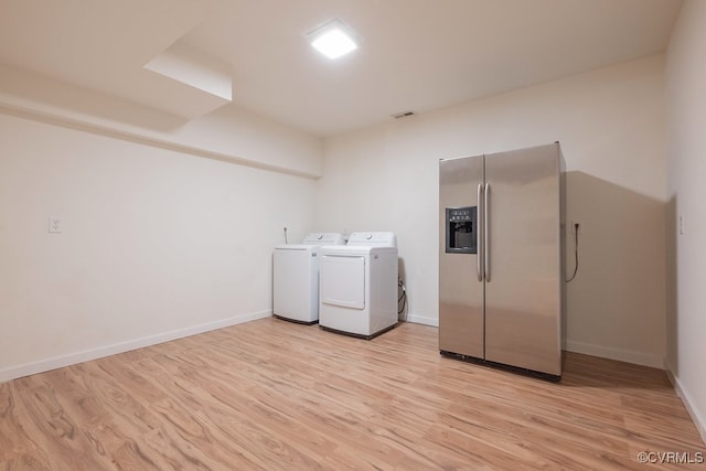 10801 Cherry Hill Dr, Glen Allen, VA 23059 - laundry area with washer and clothes dryer and light wood-type flooring