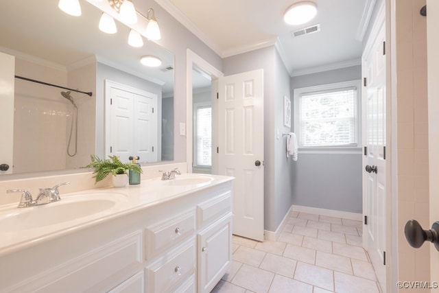 10801 Cherry Hill Dr, Glen Allen, VA 23059 - full bathroom with double vanity, tile patterned floors, crown molding, and a shower