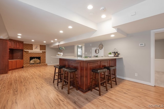 10801 Cherry Hill Dr, Glen Allen, VA 23059 - indoor wet bar with light wood-style floors, recessed lighting, and a brick fireplace