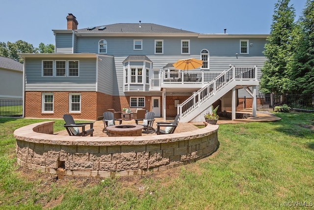 10801 Cherry Hill Dr, Glen Allen, VA 23059 - back of property with a fire pit, stairs, a deck, brick siding, and a chimney
