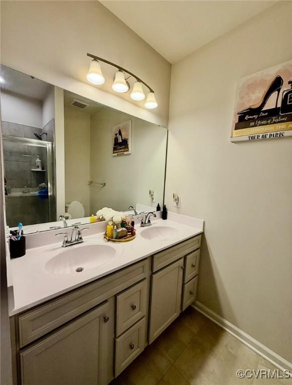 2007 Turtle Pkwy, Henrico, VA 23150 - bathroom featuring double vanity, a shower stall, and tile patterned flooring