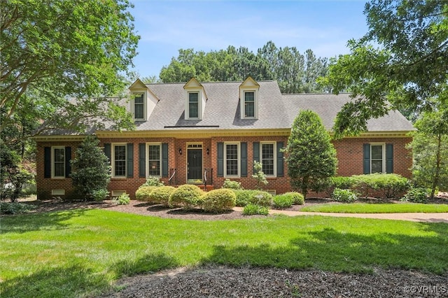 2019 Hornes Lake Rd, Williamsburg, VA 23185 - cape cod home with brick siding, a front lawn, and roof with shingles
