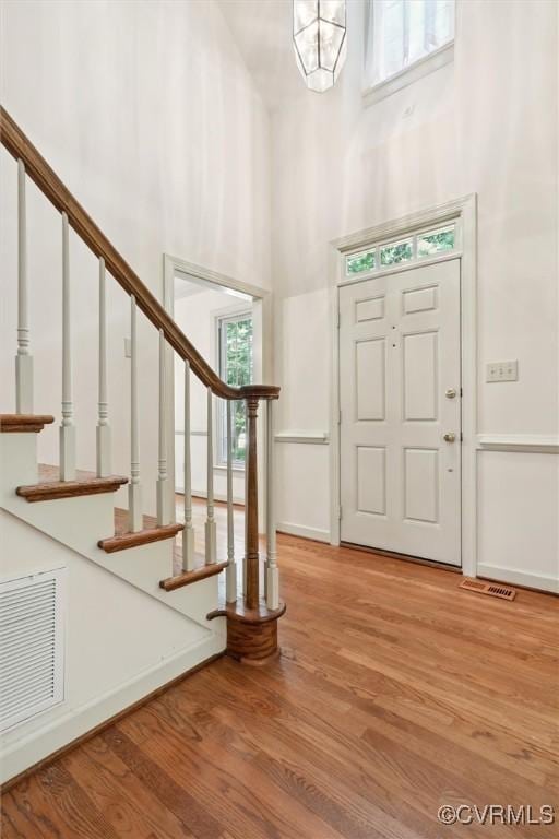 2019 Hornes Lake Rd, Williamsburg, VA 23185 - entryway featuring wood finished floors, a towering ceiling, and stairs