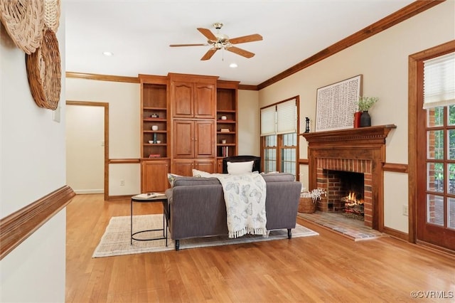 2019 Hornes Lake Rd, Williamsburg, VA 23185 - living area with ceiling fan, ornamental molding, light wood-type flooring, a brick fireplace, and recessed lighting