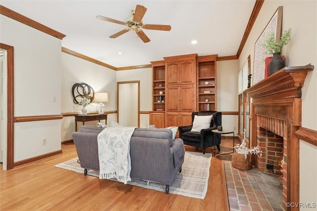 2019 Hornes Lake Rd, Williamsburg, VA 23185 - living room with ornamental molding, a fireplace, a ceiling fan, recessed lighting, and light wood finished floors