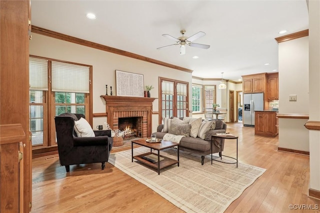 2019 Hornes Lake Rd, Williamsburg, VA 23185 - living room with ceiling fan, light wood-style floors, a fireplace, ornamental molding, and recessed lighting