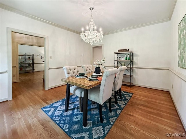 2019 Hornes Lake Rd, Williamsburg, VA 23185 - dining space with a chandelier, ornamental molding, and wood finished floors