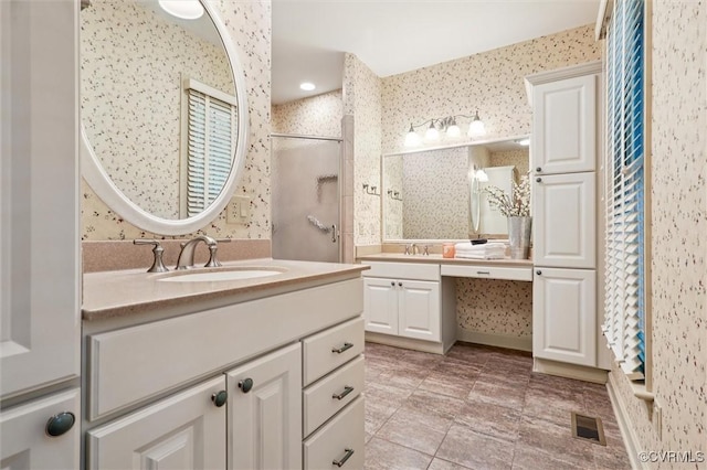 2019 Hornes Lake Rd, Williamsburg, VA 23185 - bathroom with two vanities, walk in shower, wallpapered walls, and tile patterned floors