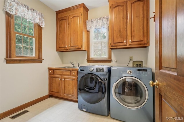 2019 Hornes Lake Rd, Williamsburg, VA 23185 - washroom with cabinet space, independent washer and dryer, and light floors