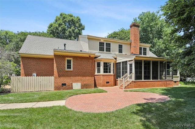 2019 Hornes Lake Rd, Williamsburg, VA 23185 - back of property with a sunroom, crawl space, a patio area, a chimney, and brick siding
