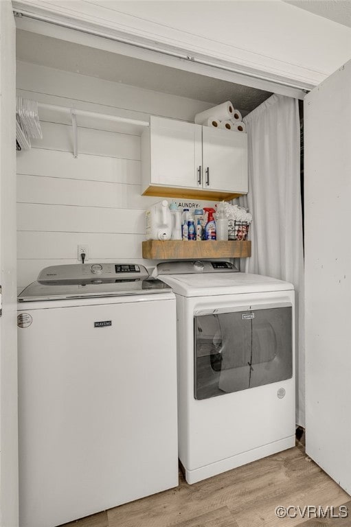 453 Manquin Dr, King William, VA 23009 - laundry room featuring separate washer and dryer, light wood finished floors, and cabinet space