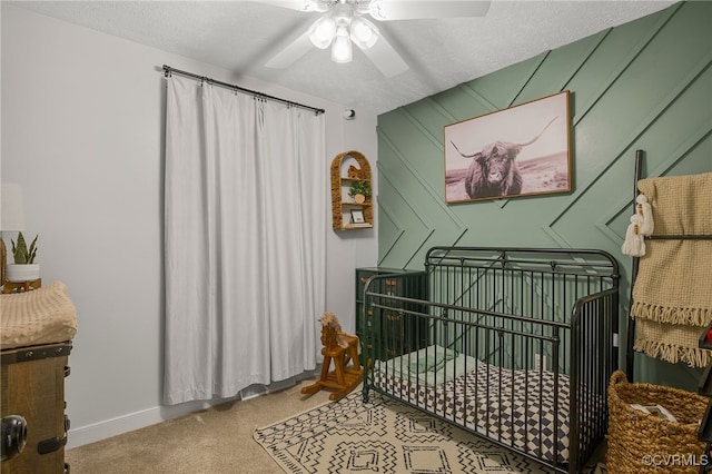 453 Manquin Dr, King William, VA 23009 - carpeted bedroom featuring a crib, a ceiling fan, and a textured ceiling