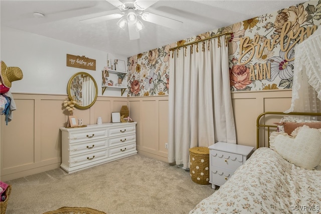 453 Manquin Dr, King William, VA 23009 - bedroom with a decorative wall, wainscoting, light carpet, wallpapered walls, and a ceiling fan