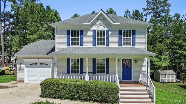 4107 Forest Vine Pl, Chesterfield, VA 23834 - view of front of home with a porch, concrete driveway, a storage unit, a garage, and a shingled roof