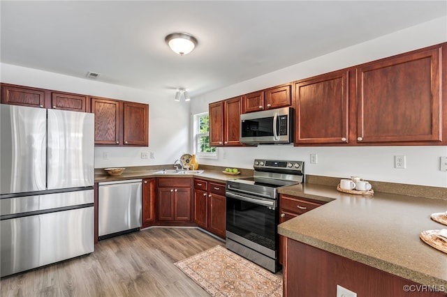 4107 Forest Vine Pl, Chesterfield, VA 23834 - kitchen with stainless steel appliances and light wood-style flooring