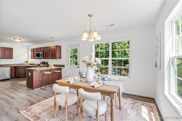 4107 Forest Vine Pl, Chesterfield, VA 23834 - dining area featuring a chandelier and light wood-style flooring