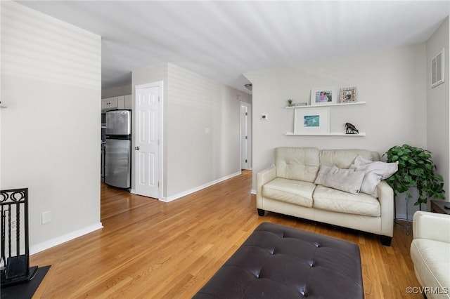 14715 Boyces Cove Dr, Midlothian, VA 23112 - living room featuring light wood-style floors and baseboards