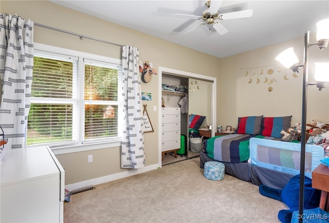 10598 Lambeth Rd, Glen Allen, VA 23060 - carpeted bedroom with multiple windows, a closet, and a ceiling fan