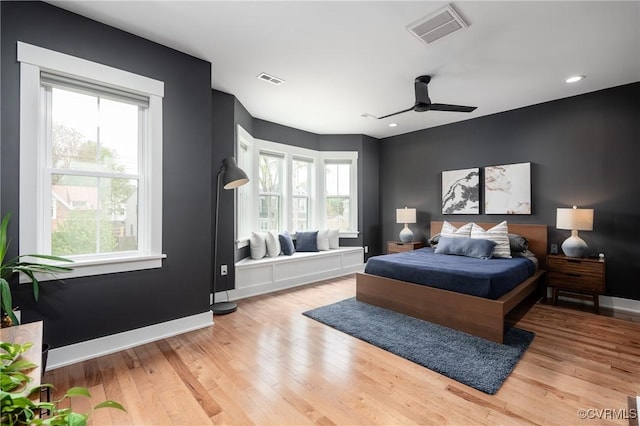 2114 N Ave, Richmond, VA 23222 - bedroom with multiple windows, light wood finished floors, recessed lighting, and ceiling fan