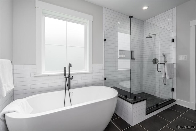 2114 N Ave, Richmond, VA 23222 - full bath with a freestanding tub, a shower stall, recessed lighting, tile patterned flooring, and tile walls