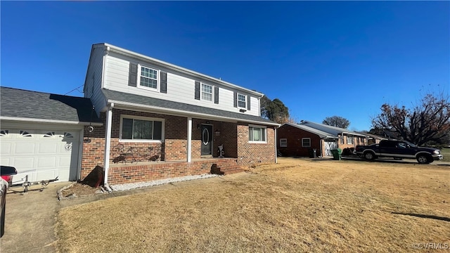 1112 Canterbury Ln, Colonial Heights, VA 23834 - traditional-style house featuring a porch, brick siding, a garage, and a front lawn