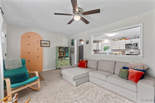 520 Monte Verde Rd, Center Cross, VA 22437 - carpeted living area with arched walkways and a ceiling fan