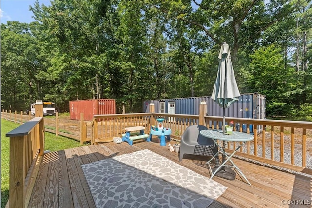 520 Monte Verde Rd, Center Cross, VA 22437 - wooden terrace with a storage unit and view of wooded area