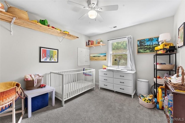 520 Monte Verde Rd, Center Cross, VA 22437 - carpeted bedroom featuring a crib and ceiling fan