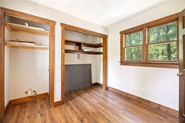3180 Judes Ferry Rd, Powhatan, VA 23139 - unfurnished bedroom with wood finished floors and a closet