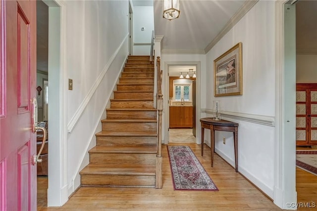 10903 Gayton Rd, Henrico, VA 23238 - stairway featuring wood finished floors, a decorative wall, and crown molding