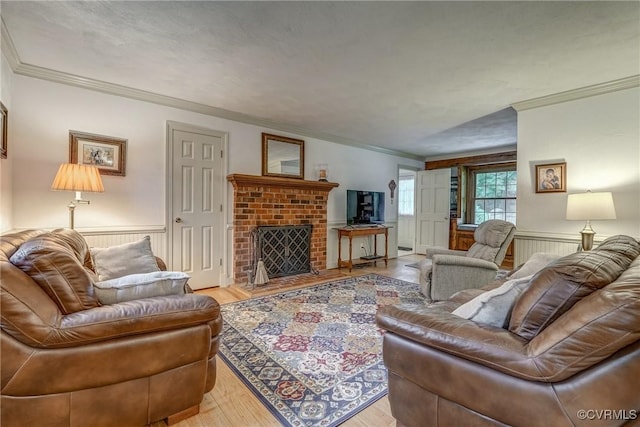 10903 Gayton Rd, Henrico, VA 23238 - living area with crown molding, light wood-style floors, a wainscoted wall, and a fireplace