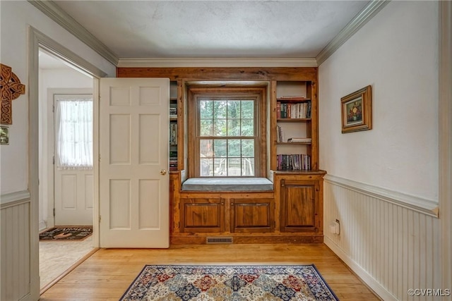 10903 Gayton Rd, Henrico, VA 23238 - foyer entrance with light wood-style flooring, wainscoting, and crown molding