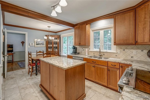 10903 Gayton Rd, Henrico, VA 23238 - kitchen with a chandelier, tasteful backsplash, a kitchen island, light stone countertops, and brown cabinets