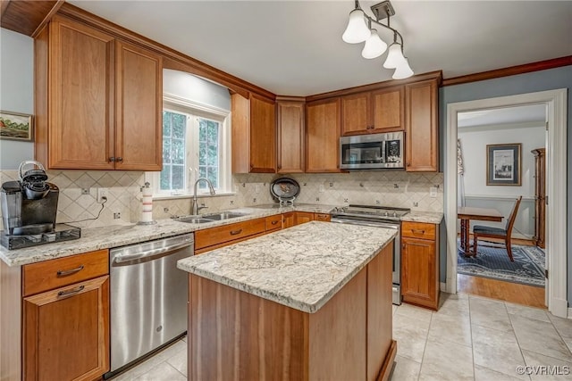 10903 Gayton Rd, Henrico, VA 23238 - kitchen featuring stainless steel appliances, brown cabinetry, a kitchen island, and crown molding