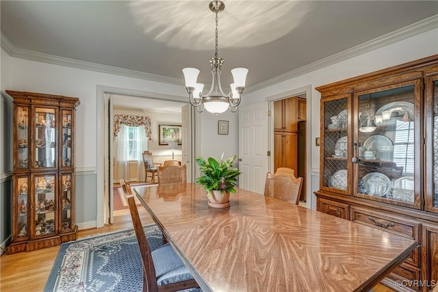 10903 Gayton Rd, Henrico, VA 23238 - dining room featuring a chandelier, light wood-style flooring, and crown molding