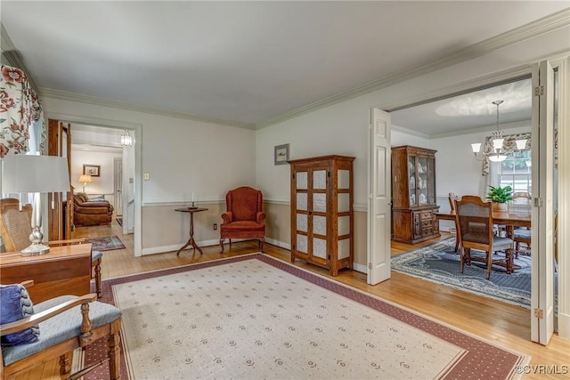 10903 Gayton Rd, Henrico, VA 23238 - living area featuring wood finished floors, a chandelier, and ornamental molding
