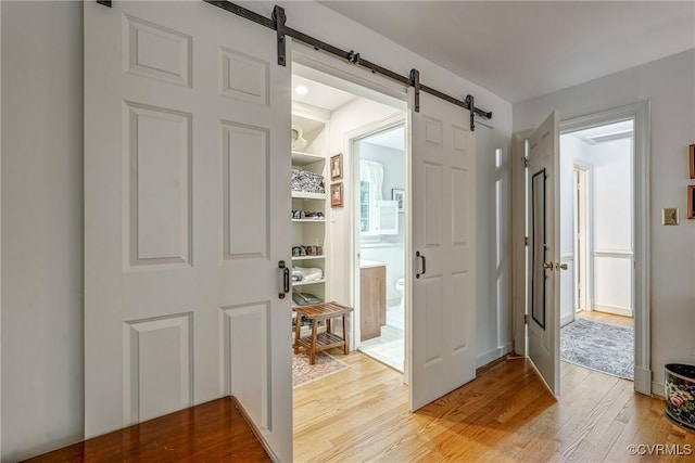 10903 Gayton Rd, Henrico, VA 23238 - entrance foyer featuring a barn door and light wood-style floors