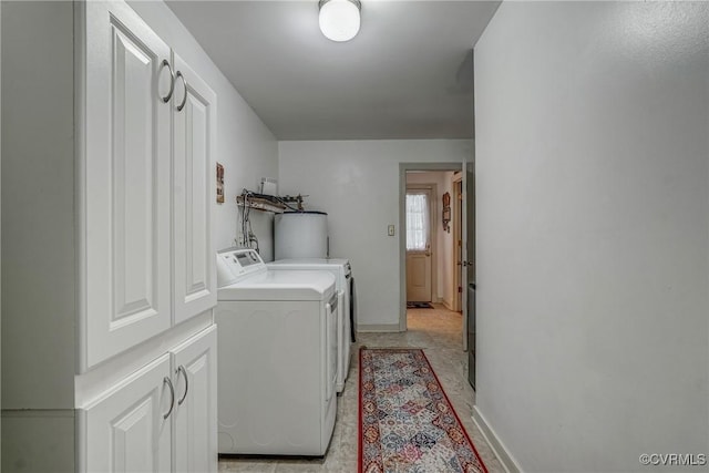 10903 Gayton Rd, Henrico, VA 23238 - laundry room with washing machine and clothes dryer, water heater, and cabinet space