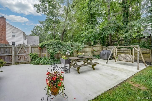 10903 Gayton Rd, Henrico, VA 23238 - fenced backyard featuring a patio area, outdoor dining space, area for grilling, and a gate