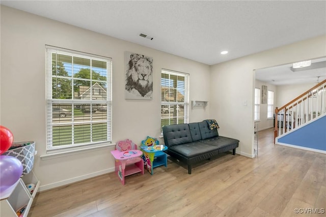 3706 Paul Karnes Dr, Hopewell, VA 23860 - living area with wood finished floors, recessed lighting, and stairway