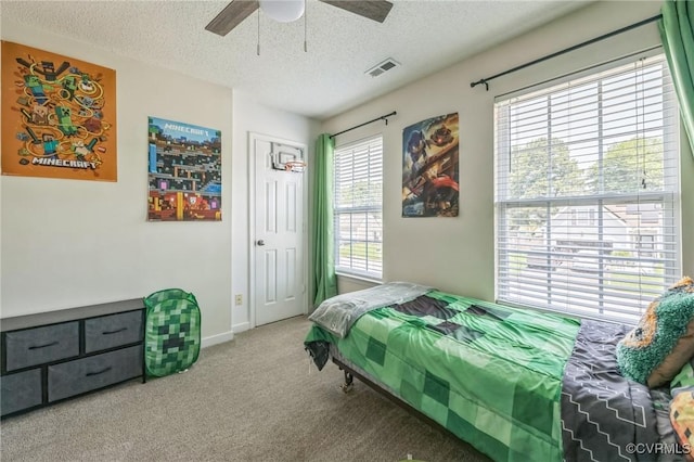 3706 Paul Karnes Dr, Hopewell, VA 23860 - carpeted bedroom featuring a textured ceiling, a ceiling fan, and a closet